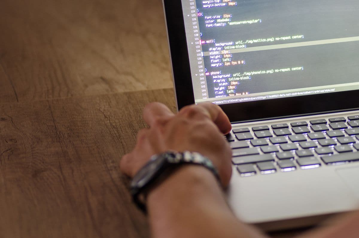 Developer Reviewing Generated Test Cases on a Laptop